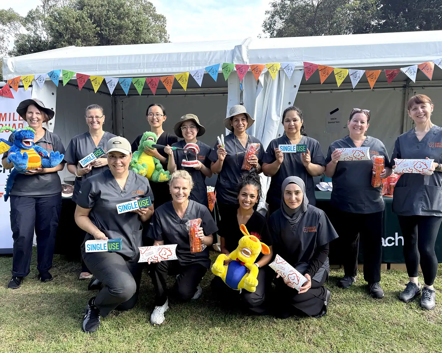 Dental fair group photo with dentists and products